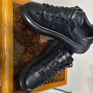 Alexander McQueen Black Sneakers with Gold Accents